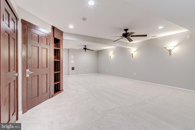 interior space with light colored carpet and ceiling fan