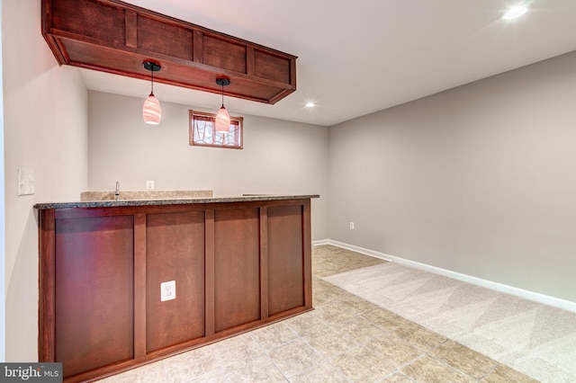 bar featuring hanging light fixtures