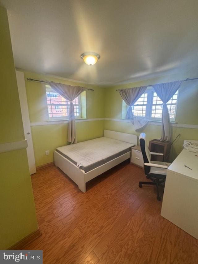 bedroom featuring hardwood / wood-style floors