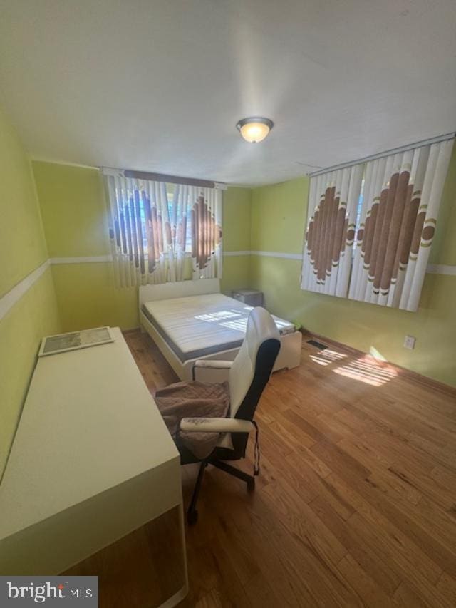 bedroom featuring hardwood / wood-style flooring