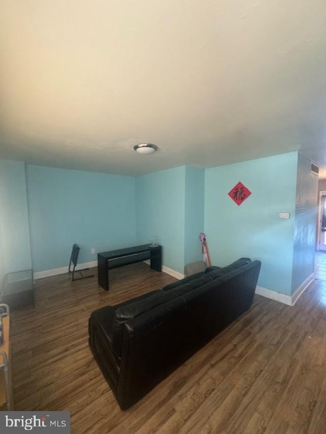 living room featuring dark hardwood / wood-style flooring