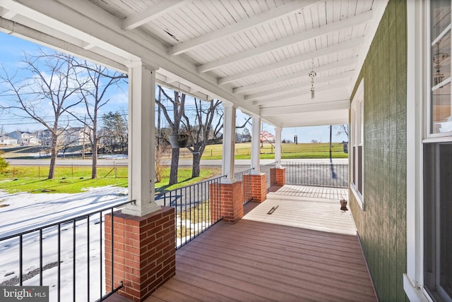 wooden terrace featuring a porch