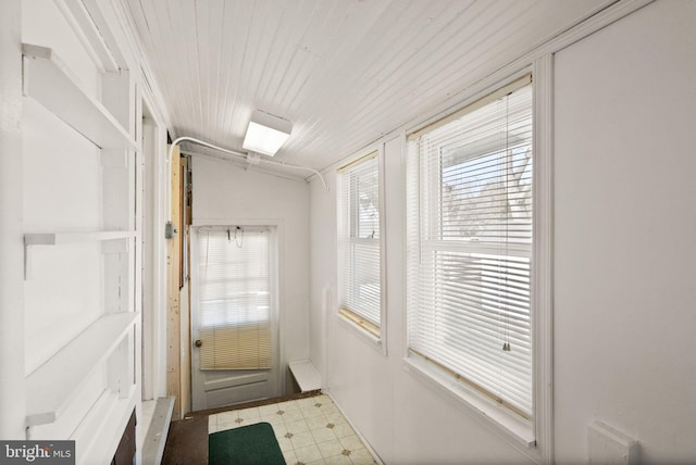 doorway with wood ceiling