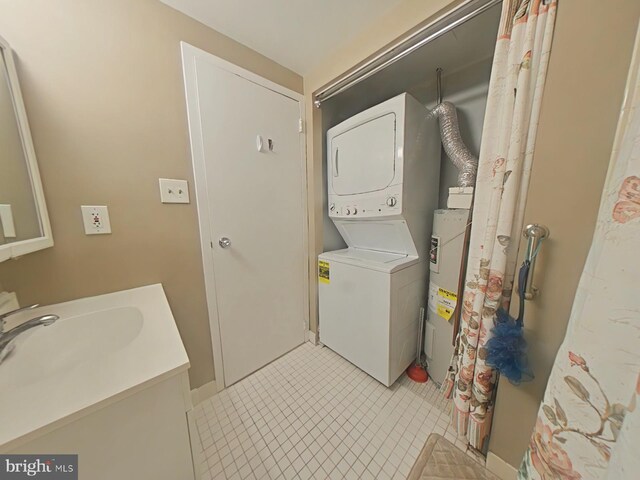 washroom with stacked washer and dryer, sink, and water heater