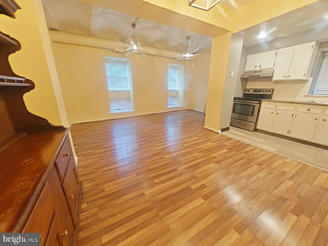 kitchen featuring ceiling fan, electric range, light hardwood / wood-style flooring, and white cabinets