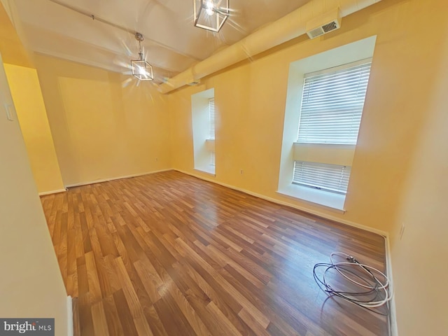 unfurnished room featuring wood-type flooring
