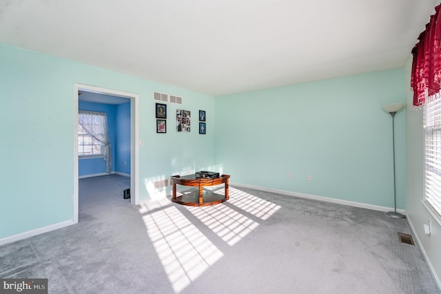 unfurnished room with carpet floors