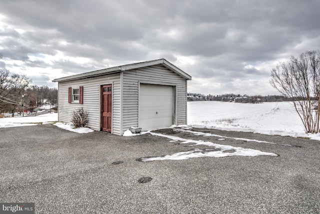 view of snow covered garage