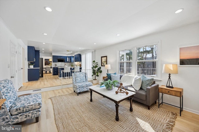 living room with light hardwood / wood-style floors