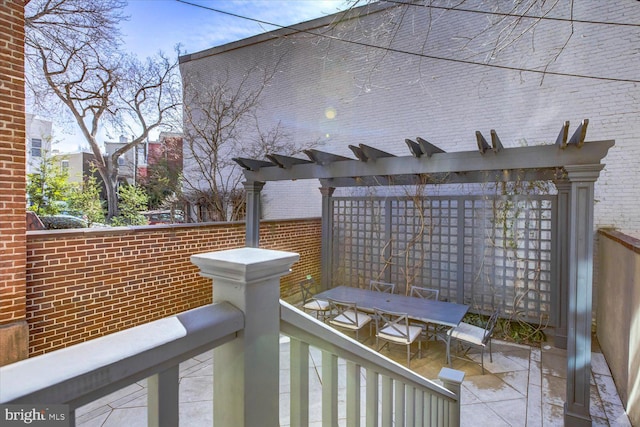 deck with outdoor dining area and a pergola