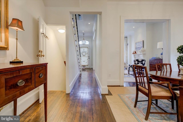 interior space with hardwood / wood-style flooring and baseboards