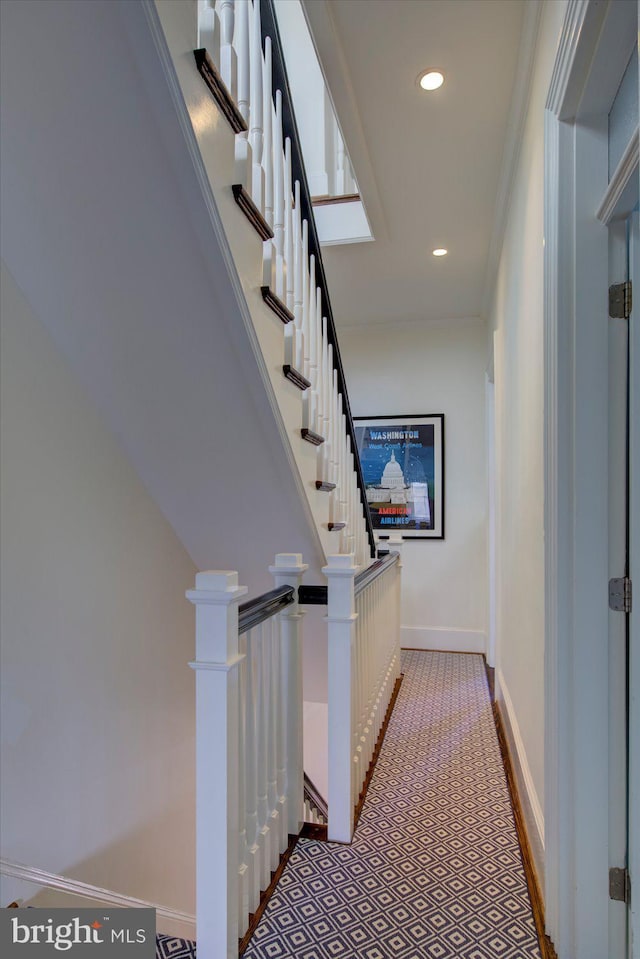 hallway with recessed lighting, baseboards, and ornamental molding