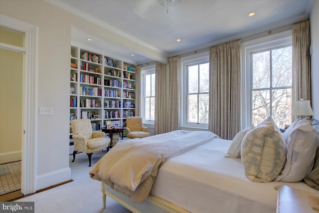 carpeted bedroom featuring recessed lighting, baseboards, multiple windows, and ornamental molding