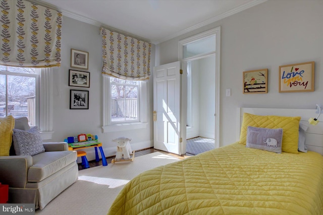 bedroom with baseboards and ornamental molding