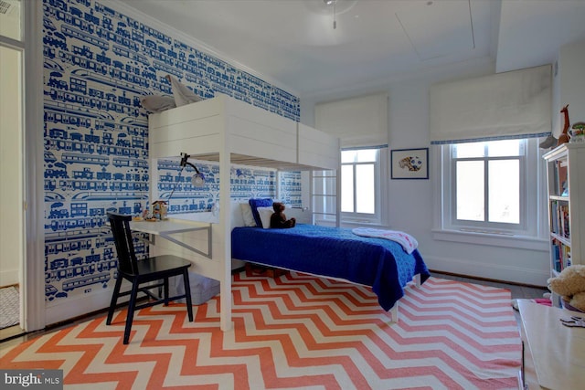 bedroom featuring baseboards and ornamental molding