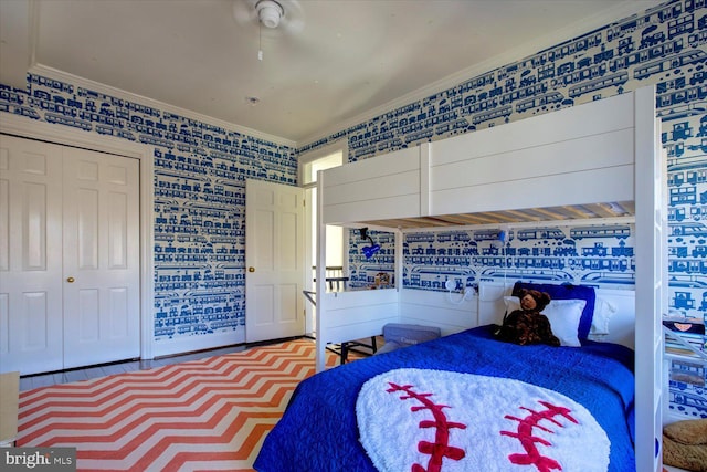 bedroom with a closet and ornamental molding