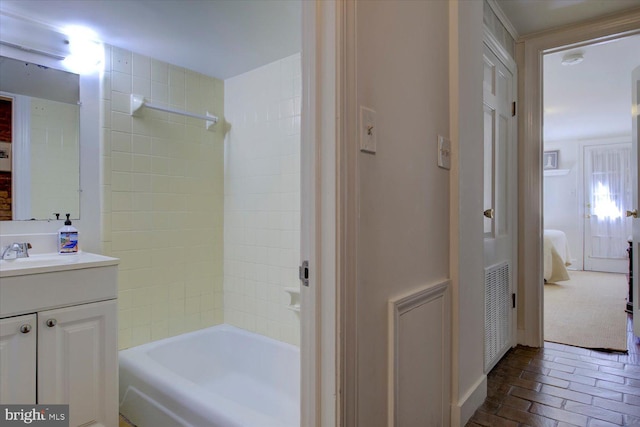 full bath featuring visible vents, connected bathroom, shower / tub combination, brick floor, and vanity