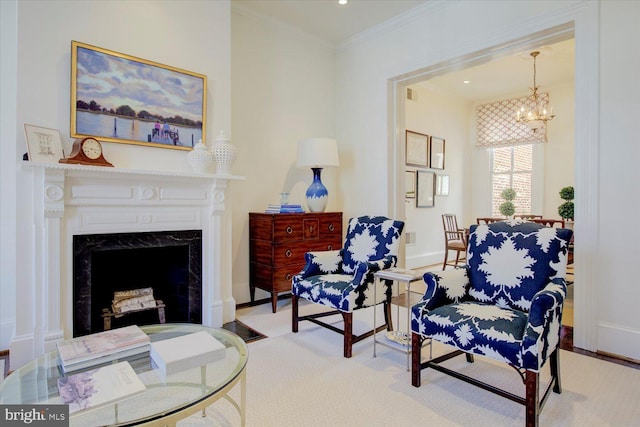 living area featuring a high end fireplace, baseboards, and crown molding