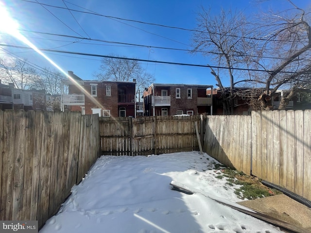 view of yard covered in snow