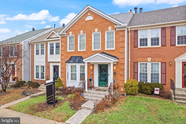 view of property with a front lawn