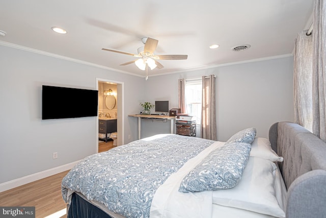 bedroom featuring ceiling fan, ornamental molding, wood-type flooring, and ensuite bathroom