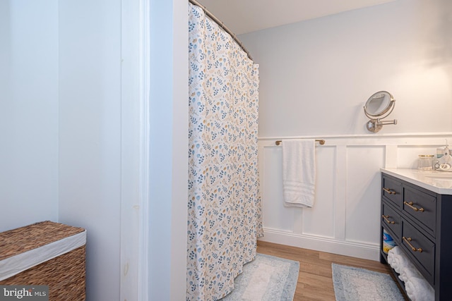 bathroom featuring hardwood / wood-style flooring and vanity