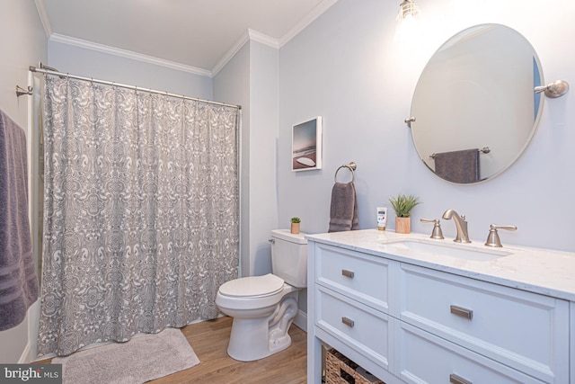 bathroom with toilet, crown molding, wood-type flooring, vanity, and a shower with shower curtain