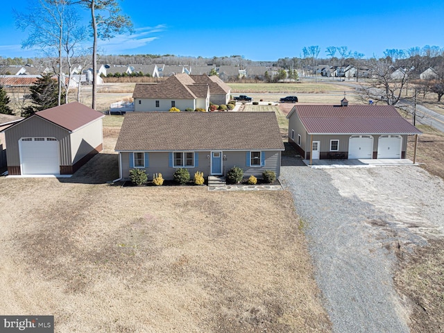 view of front of house with an outbuilding and a garage