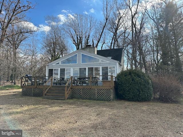 view of front of house featuring a wooden deck