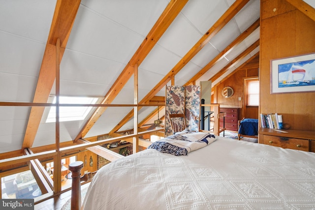 bedroom with vaulted ceiling with beams and wood walls