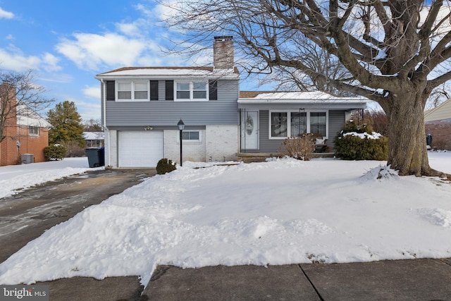 split level home featuring a garage