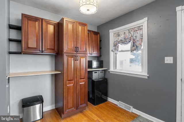 kitchen with light hardwood / wood-style flooring