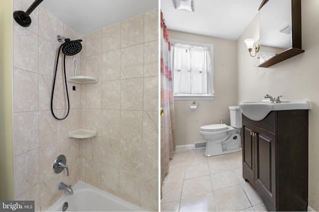 full bathroom featuring vanity, shower / bath combination with curtain, tile patterned floors, and toilet