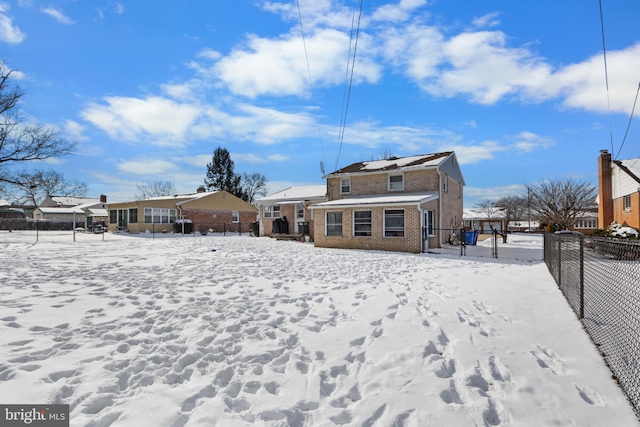 view of snow covered house