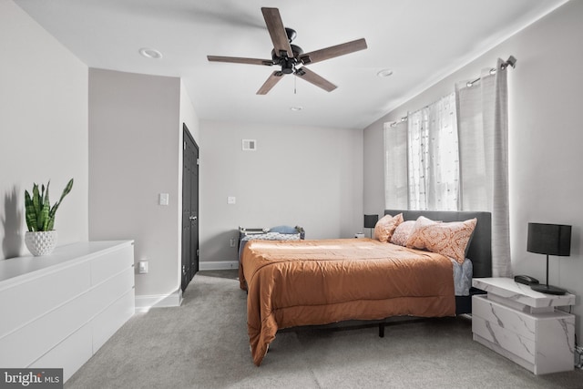 bedroom with light colored carpet and ceiling fan