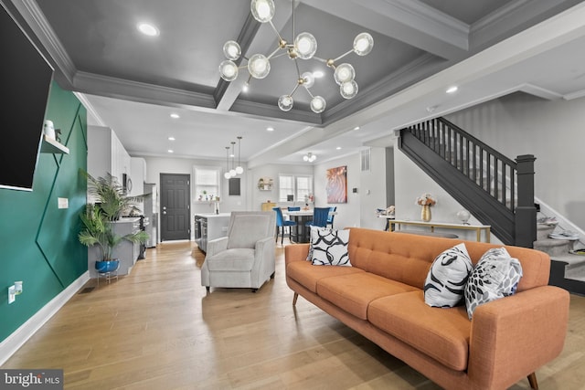 living room with ornamental molding, beam ceiling, and a chandelier