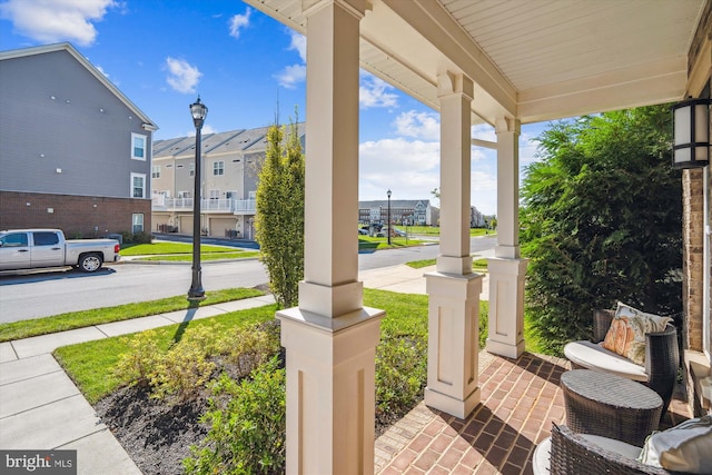 view of patio featuring a porch