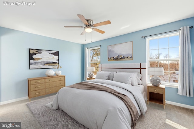 carpeted bedroom featuring ceiling fan