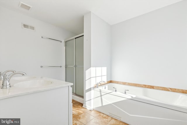 bathroom with tile patterned floors, separate shower and tub, and vanity