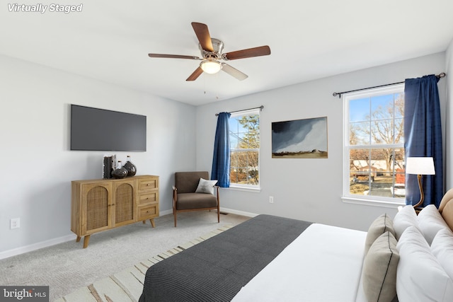 carpeted bedroom featuring ceiling fan