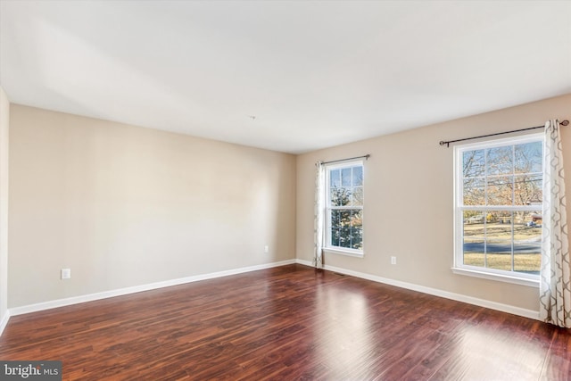 empty room featuring dark wood-type flooring