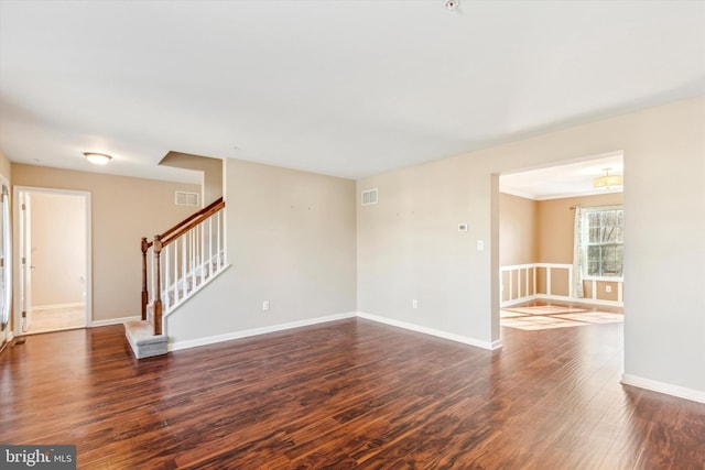 spare room featuring dark hardwood / wood-style floors