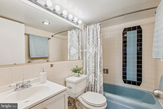 full bathroom featuring tile walls, vanity, decorative backsplash, toilet, and shower / bath combo with shower curtain