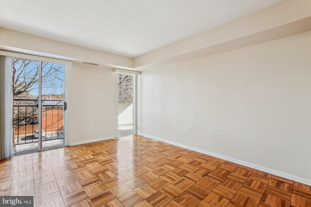 spare room featuring light parquet flooring