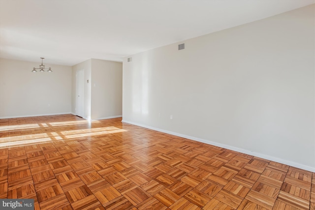 unfurnished room with light parquet floors