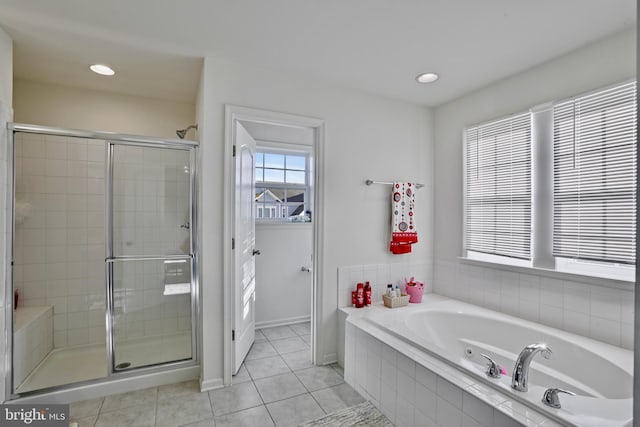 bathroom featuring separate shower and tub and tile patterned flooring