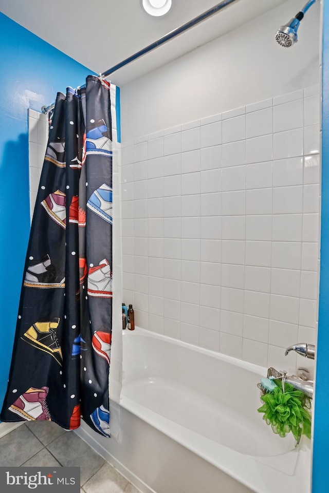 bathroom featuring shower / bathtub combination with curtain and tile patterned floors