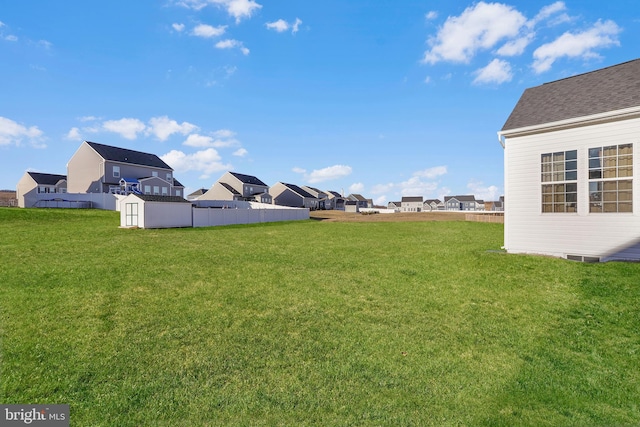 view of yard featuring a shed