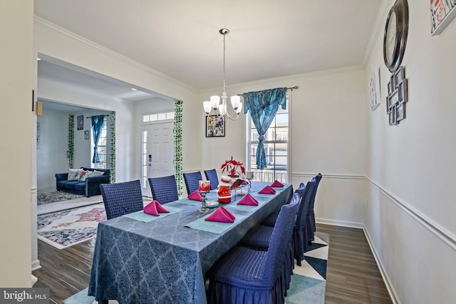 dining area featuring ornamental molding, dark hardwood / wood-style floors, and a wealth of natural light