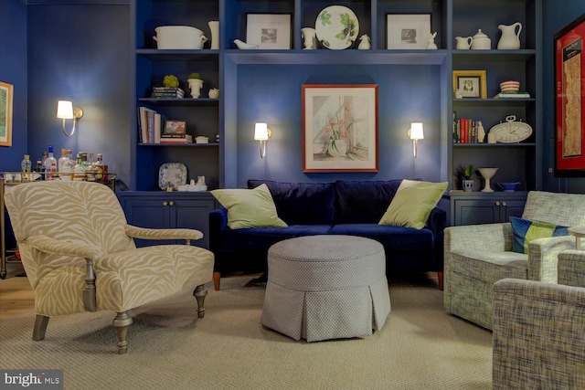 sitting room featuring built in features